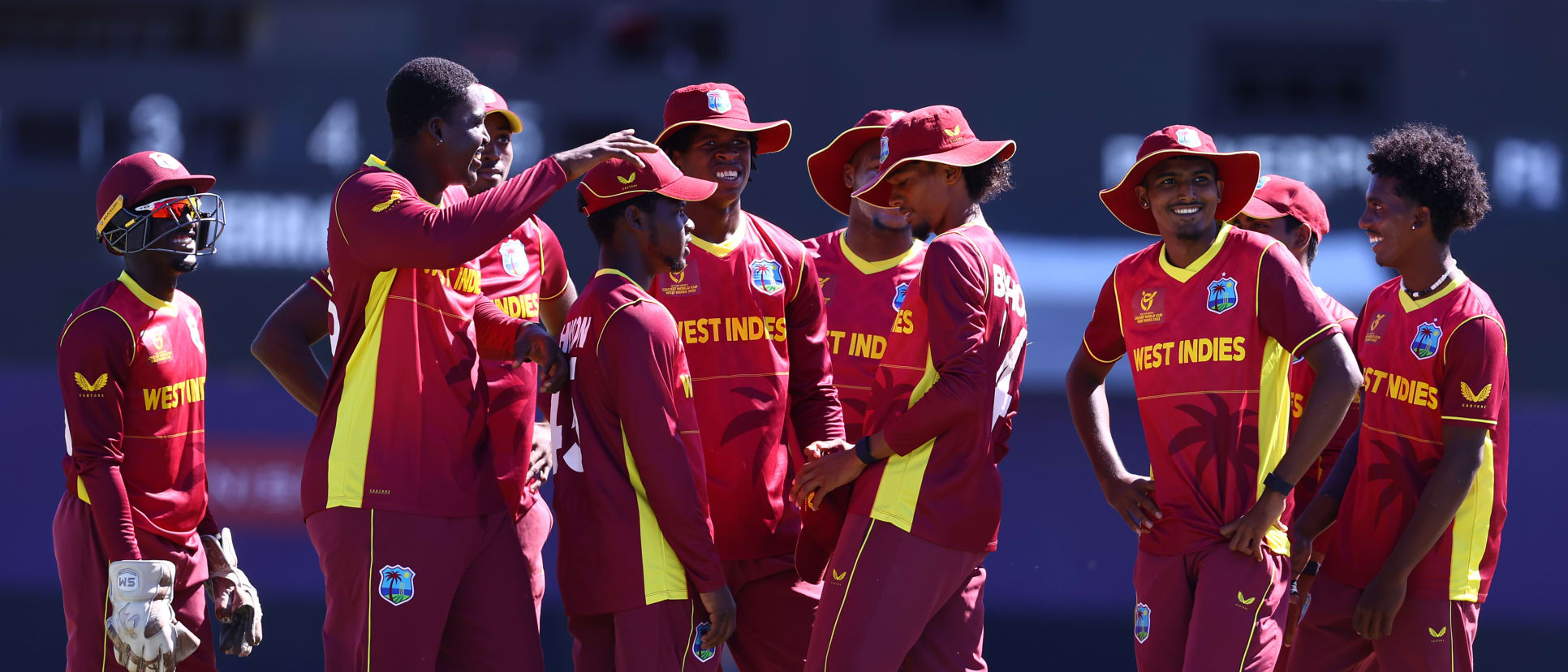 Players of West Indies huddle as they celebrate the wicket of Lyle Robertson of Scotland during the ICC U19 Men's Cricket World Cup match between West Indies and Scotland at Warner Park Sporting Complex on January 17, 2022 in Basseterre.