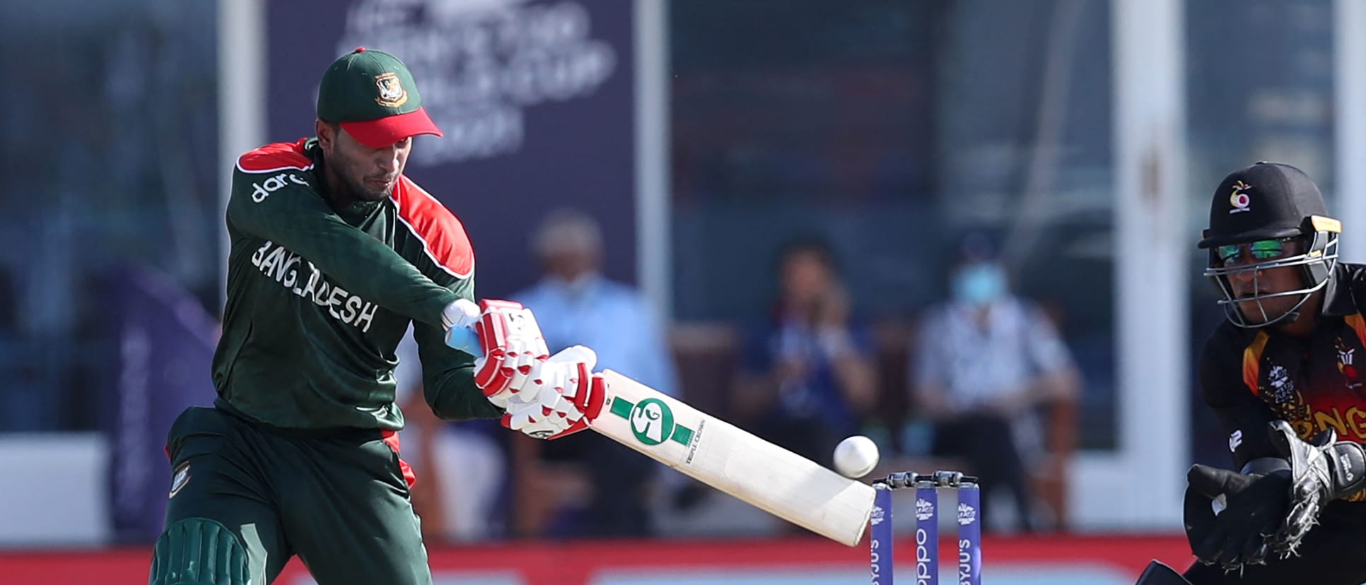 Shakib Al Hasan plays a shot during the ICC men's Twenty20 World Cup cricket match between Bangladesh and Papua New Guinea at the Oman Cricket Academy Ground in Muscat on October 21, 2021.