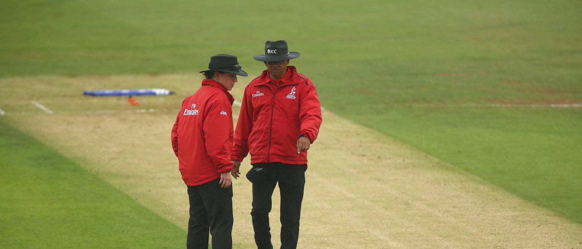 Umpires Shaun George and Claire Polosak