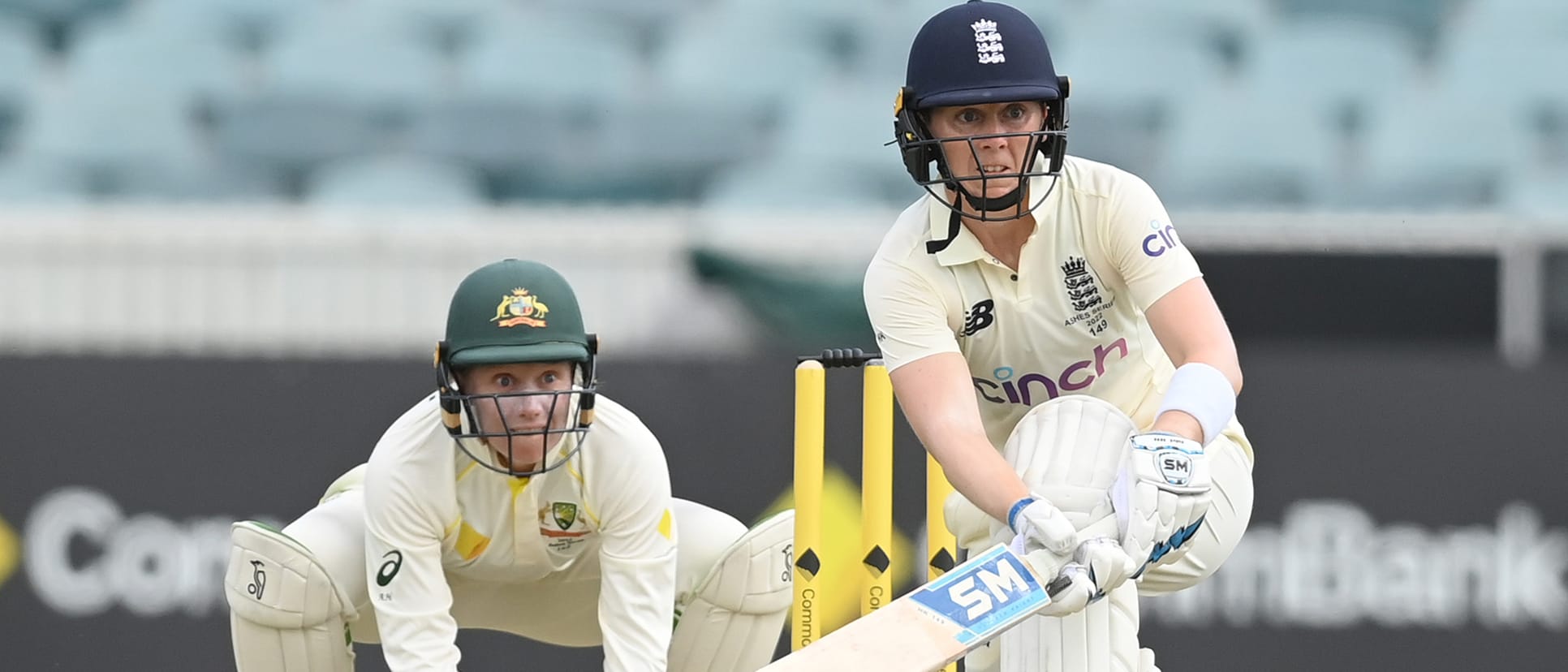 Heather Knight of England bats watched by Alyssa Healy of Australia during day two of the Women's Test match in the Ashes series between Australia and England at Manuka Oval