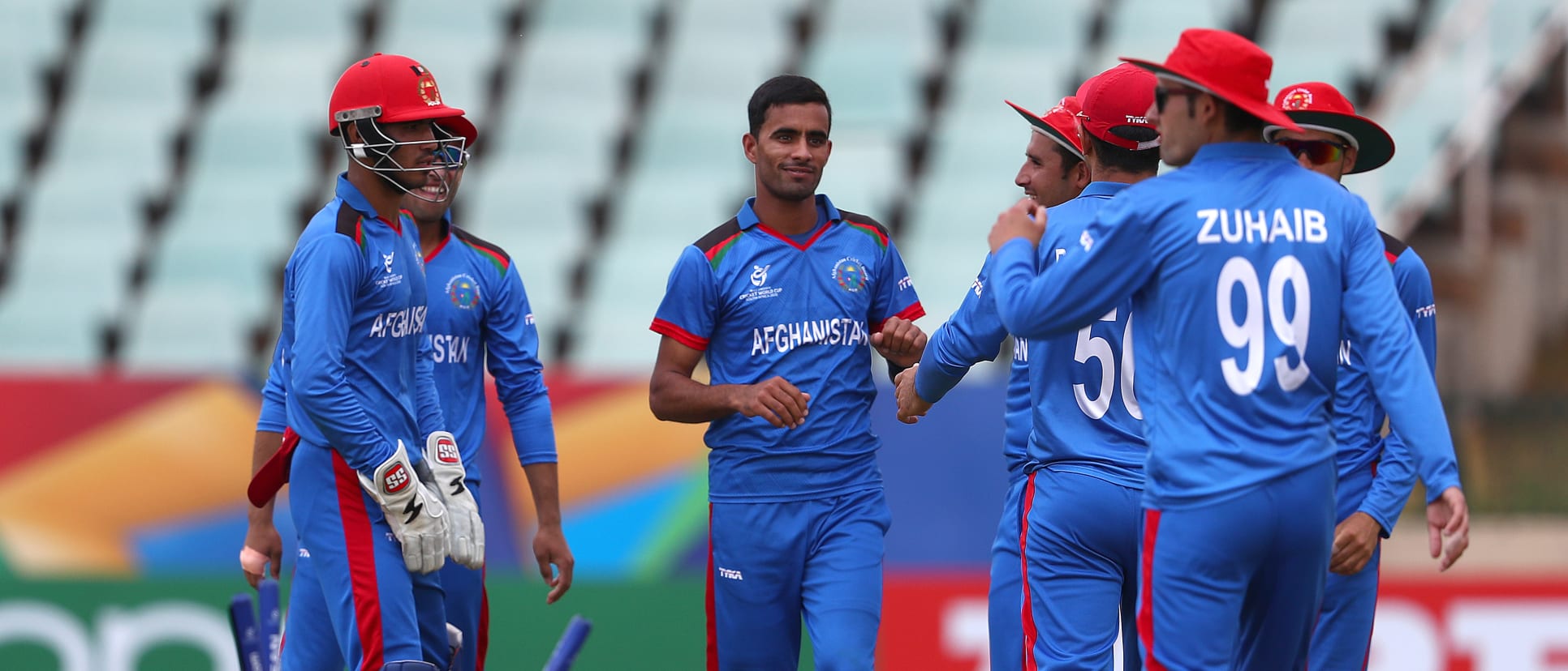 Shafiqullah Ghafari of Afghanistan is congratulated on bowling Luke Beaufort of South Africa during the ICC U19 Cricket World Cup 7th Place Play-Off match between South Africa and Afghanistan at Willowmoore Park on February 05, 2020 in Benoni.