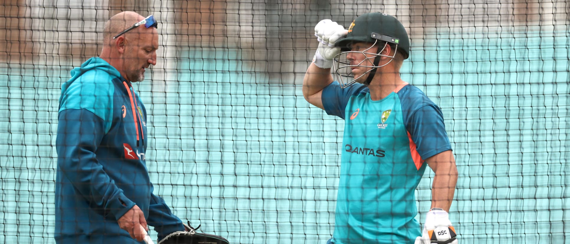 Warner receives some advice from assistant coach Michael Di Venuto