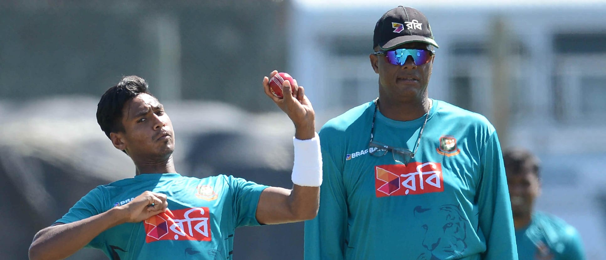 Mustafizur Rahman and Courtney Walsh