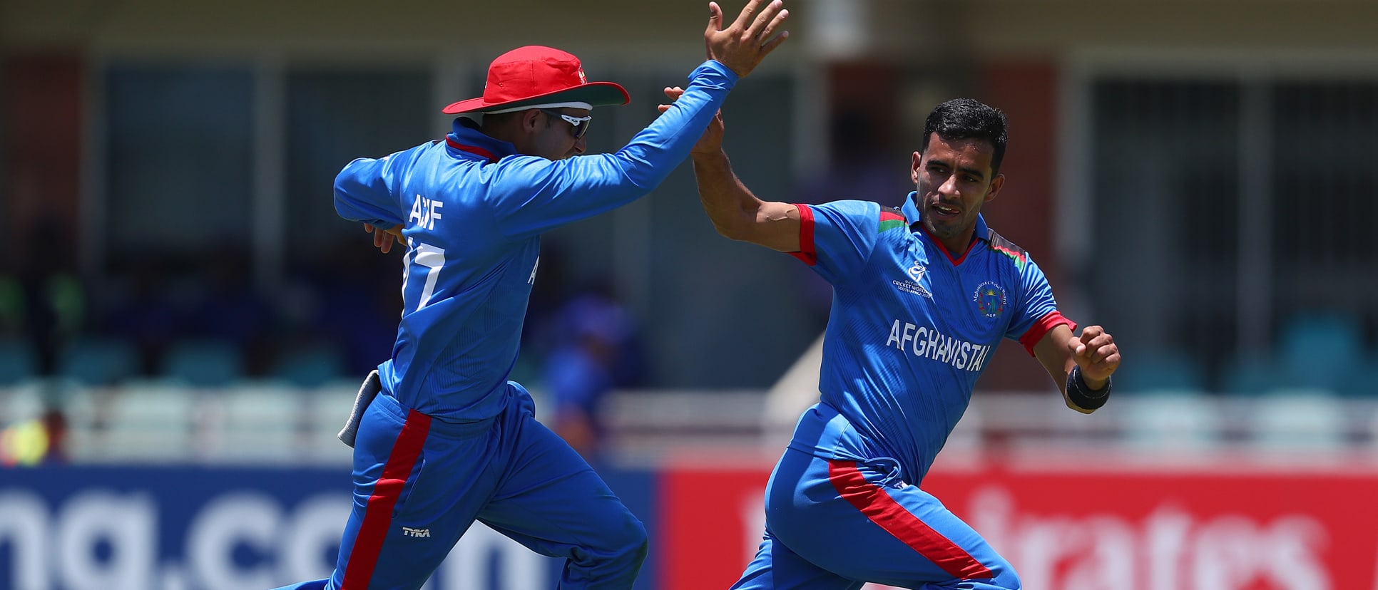 Shafiqullah Ghafari of Afghanistan celebrates with Mohammad Asif of Afghanistan, after bowling Gerald Coetzee of South Africa, January 17, 2020.