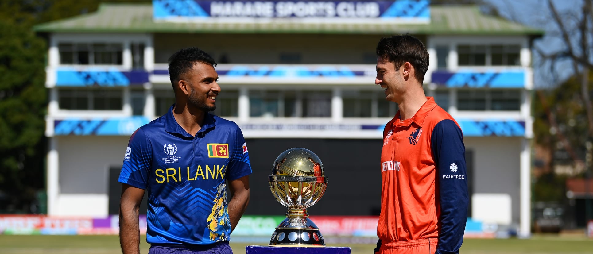 Dasun Shanaka of Sri Lanka and Scott Edwards of Netherlands pose for a photo with the ICC Men's Cricket World Cup Qualifier Trophy at Harare Sports Club on July 08, 2023 in Harare, Zimbabwe.