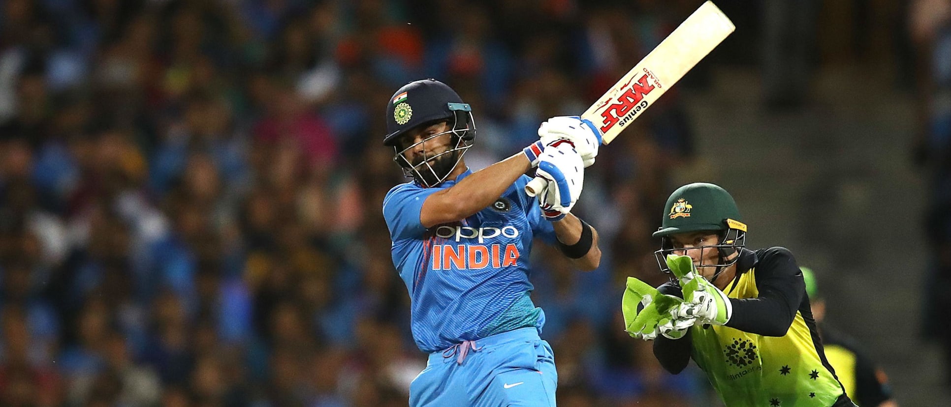 Virat Kohli and Alex Carey