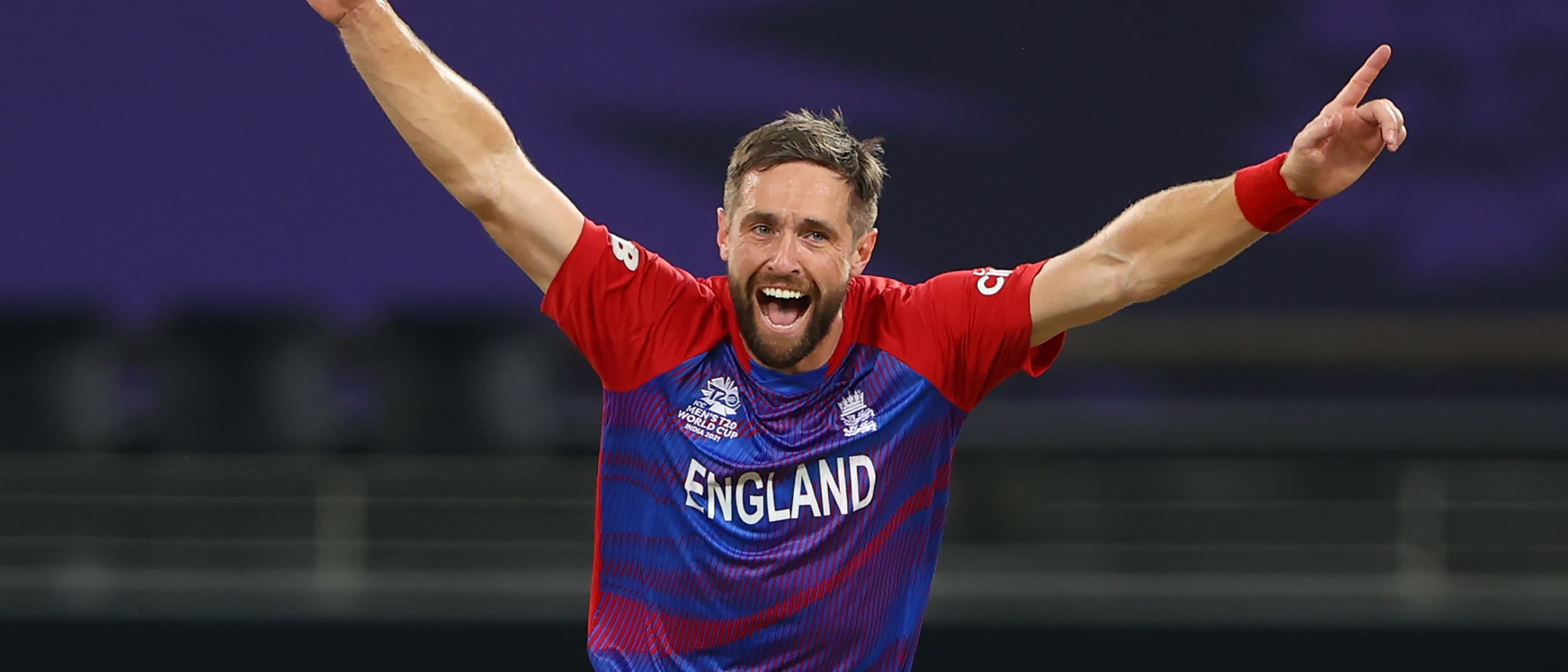 Chris Woakes of England celebrates the wicket of Glenn Maxwell of Australia during the ICC Men's T20 World Cup match between Australia and England at Dubai International Stadium on October 30, 2021 in Dubai, United Arab Emirates.