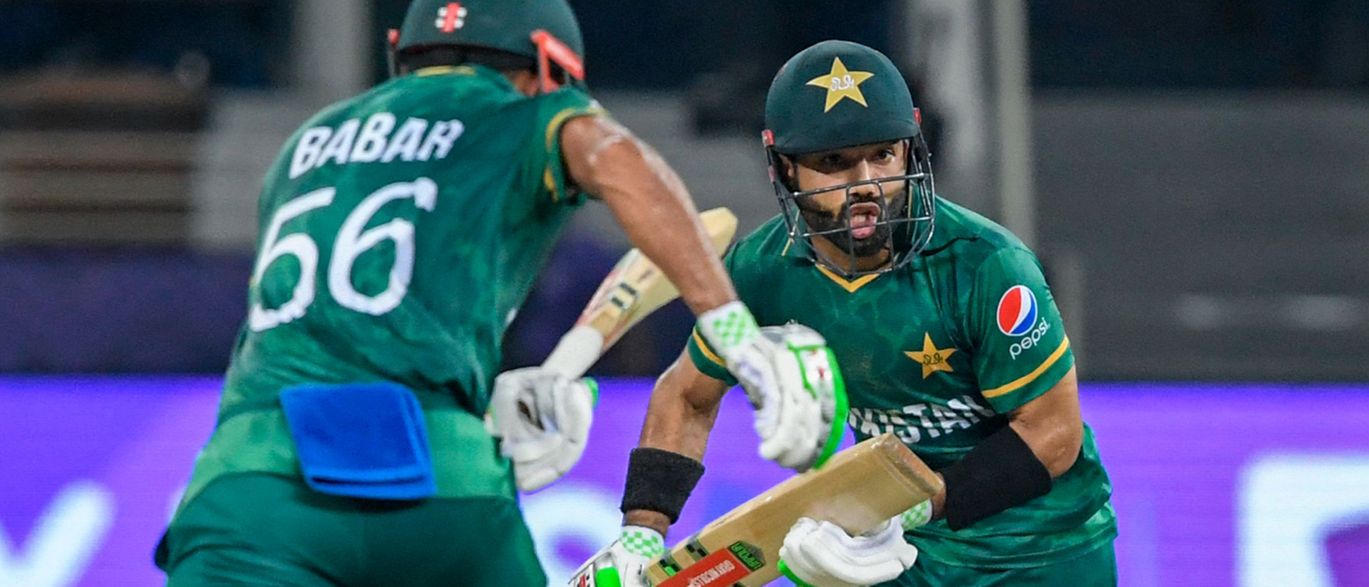 Pakistan's captain Babar Azam (L) and his teammate Mohammad Rizwan take a run 1920x1080