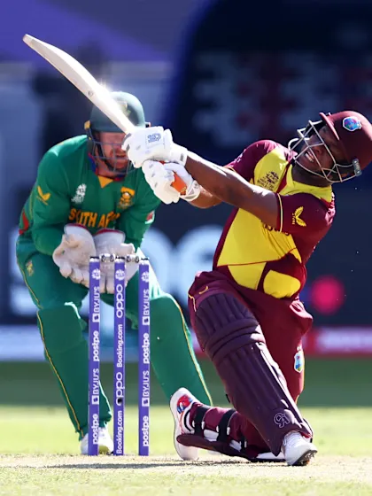 Lewis knocks up half-century with big six