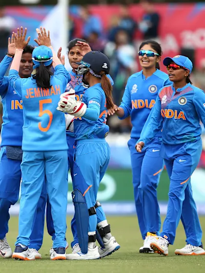 India defend 133 to seal semi-final spot