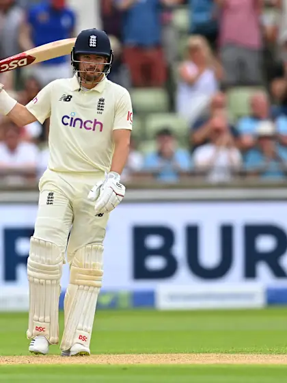 Burns, Lawrence half-centuries help keep England afloat