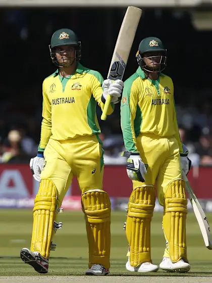 Carey and Khawaja half-centuries, Starc five-for help Australia stay at the top