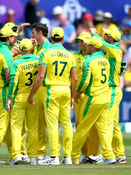 Australia steer past spirited Afghanistan to kick-start title defence