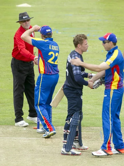 Hong Kong holds nerve, Scotland opens with win