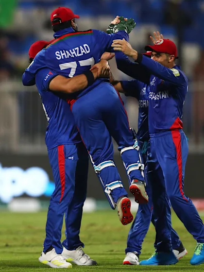Shahzad with an acrobatic effort behind the stumps
