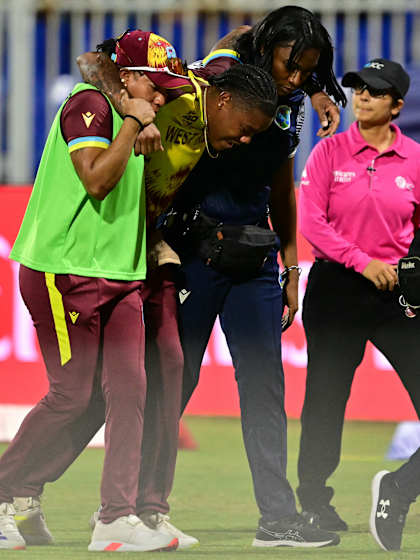 Chinelle Henry being assessed after ball strikes her in the face